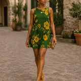 Sleeveless A-line dress with green and yellow floral print and side pockets — alternate view