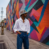 Blue checkered patchwork cotton bucket hat with brim and breathable eyelets — side view