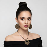 Organic-shaped wooden earrings with safari animal print and sterling silver hooks — rear view