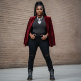 Black and red high-top women's boot with lugged sole and oversized logo tongue