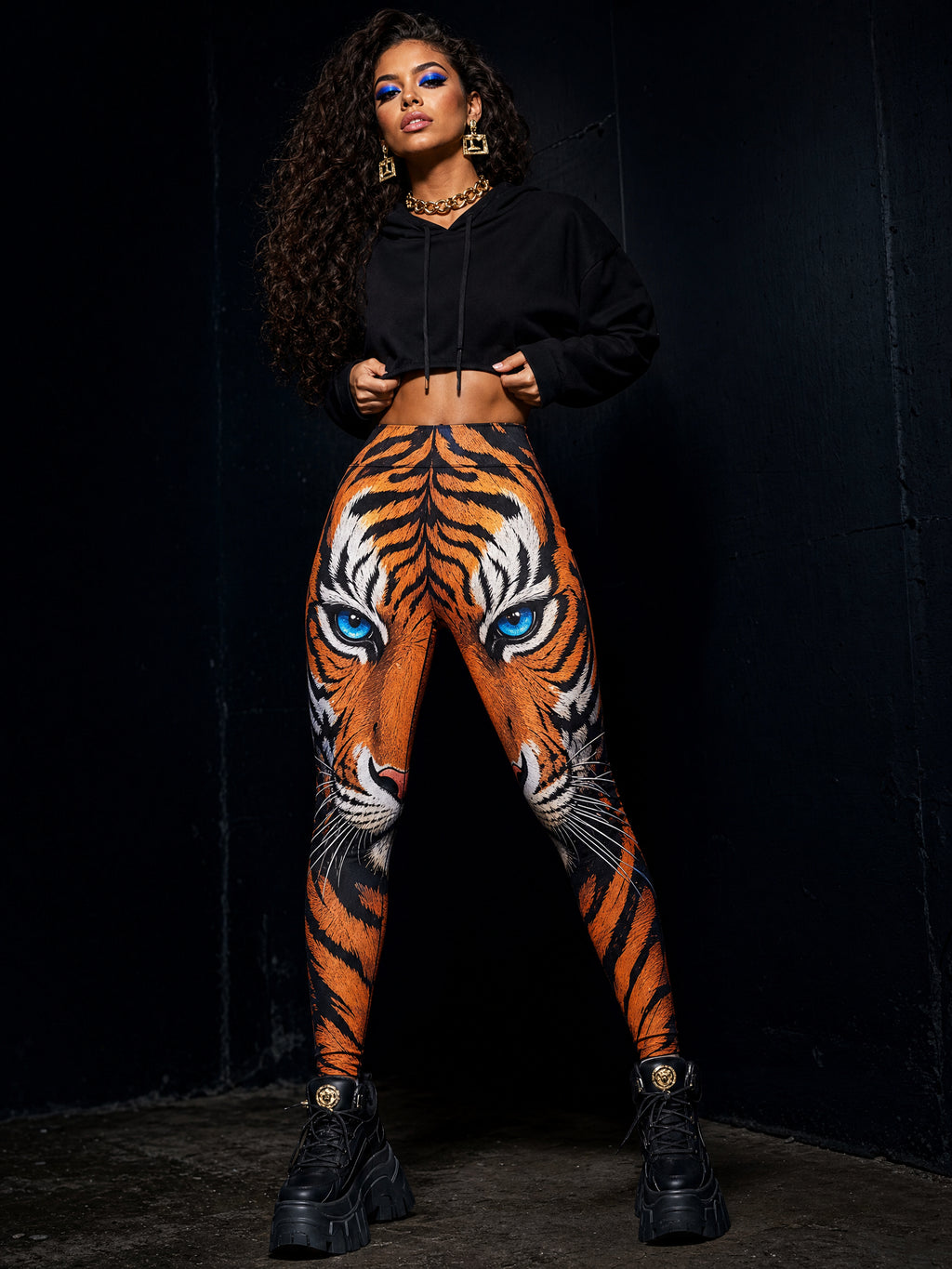 Brazilian model with curly hair wearing Blue Eyes Tiger All-Over Print Leggings