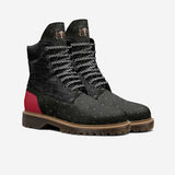 Black and red high-top women's boot with lugged sole and oversized logo tongue — rear view