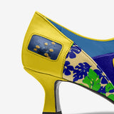 Yellow women's low-heel pump with rounded toe and plush interior lining — side view