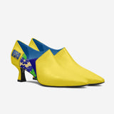 Yellow women's low-heel pump with rounded toe and plush interior lining — rear view