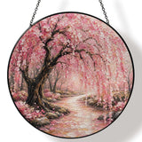 Glass suncatcher with Japanese blossom tree print hanging from a metal chain — rear view