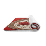 Plush Yin-Yang pet mat with tribal accents and floral details in black and ivory, 25 by 18 inches — rear view
