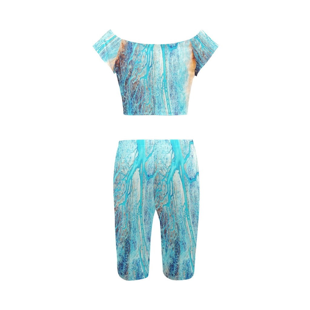 Rich and Rich Turquoise Women's Yoga Set modeled on a woman performing yoga