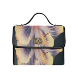 Black waterproof canvas handbag with exotic flower print and double PU leather handles