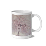 White 11 oz ceramic mug decorated with cherry blossom tree artwork and a crystal sticker decorative finish — alternate view