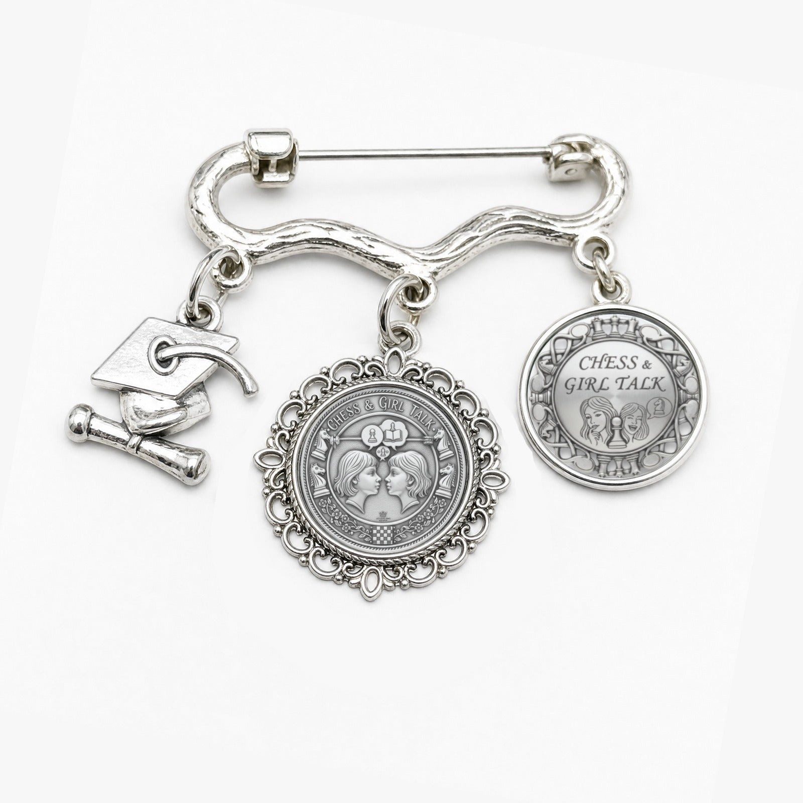 Chess Girl Talk decorative metal brooch with two round photo charms and a small graduation cap charm on a pin