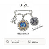 Floral brooch with birdsong motif, two round photo charms and a graduation cap charm — alternate view
