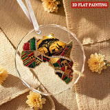 Round crystal glass ornament depicting the African continent with red ribbon and gift box — additional view 9
