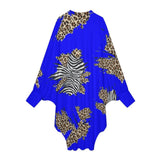 Royal blue animal print women's dress with oversized batwing sleeves and asymmetrical hem — side view