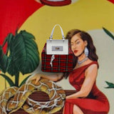 Structured red leather women's handbag with a squared flap and embossed logo — side view