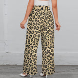 Brown animal print wide-leg women's pants with elastic waistband, tied belt, and side pockets — side view