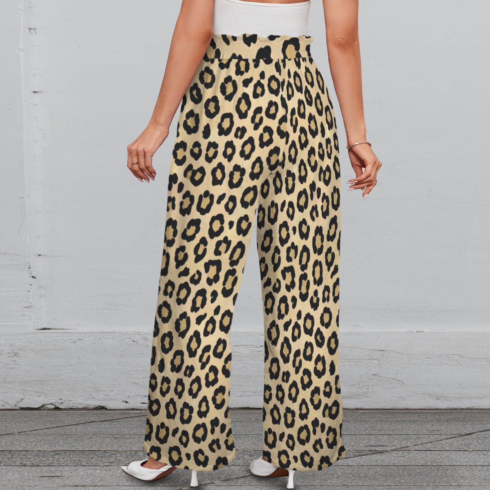 Brown animal print wide-leg women's pants with elastic waistband, tied belt, and side pockets — side view