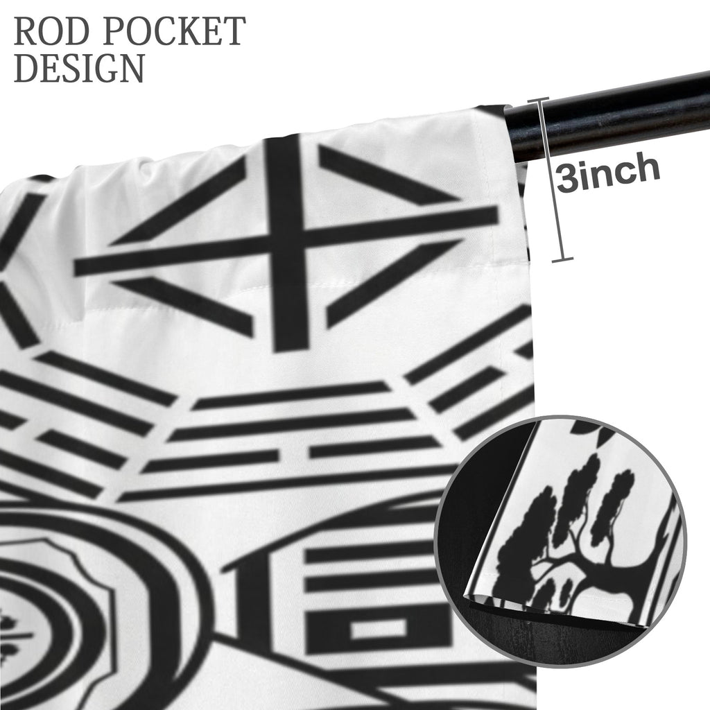 Rich and Rich Feng Shui black and white floor-to-ceiling curtains hanging in a modern living room