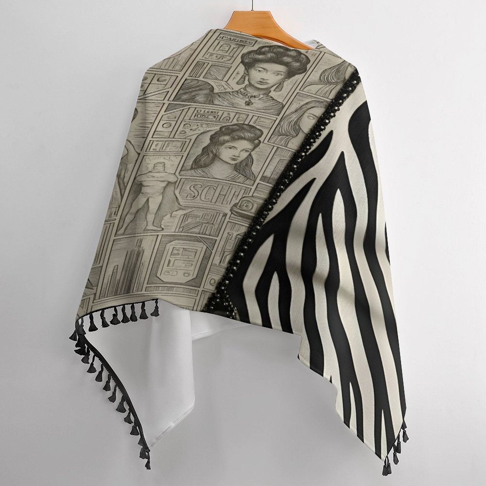 Black and beige tassel cape with loose cardigan silhouette and fringe — rear view