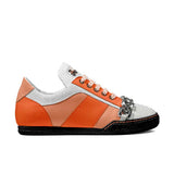 Orange low-top sneaker with chunky metal chain and textured leather panels — rear view