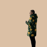Women's emerald green puffer coat with yellow tulip floral print and detachable hood — additional view 7