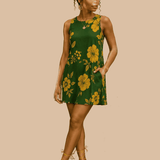 Sleeveless A-line dress with green and yellow floral print and side pockets