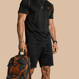 Large basketball‑style travel backpack with padded laptop sleeve and multiple exterior and interior pockets — rear view
