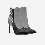 Black and white animal print slip-on boot with 10.5 cm stiletto heel — rear view