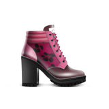 Pink and magenta animal-print leather boot heels with 8.5 cm heel and rubber sole — rear view