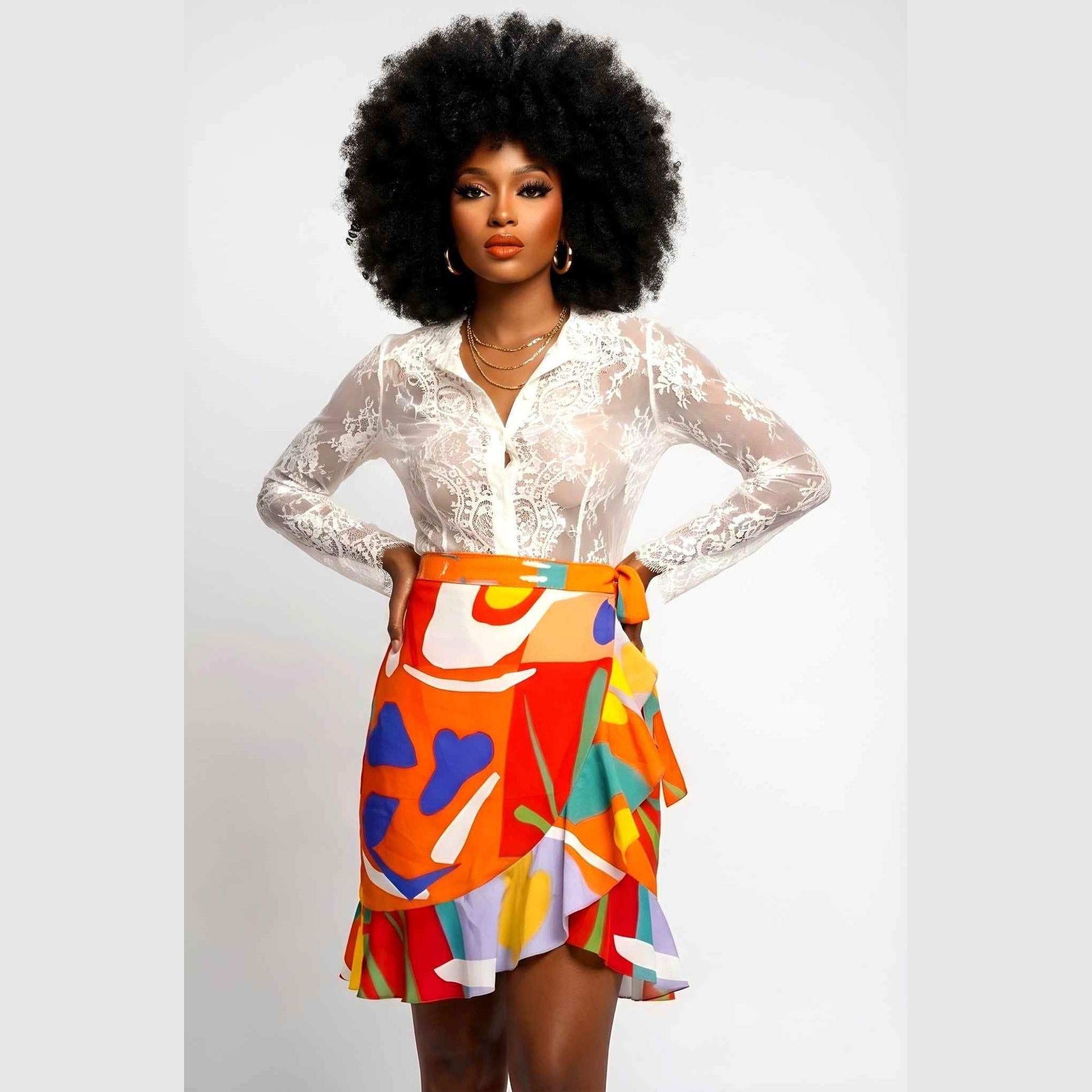 Orange abstract wrap flounce skirt in poly crepe with belt tie and flounced hem