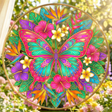 Large butterfly glass suncatcher with gold-lined wings amid pink, teal, and purple floral burst with hanging — alternate view